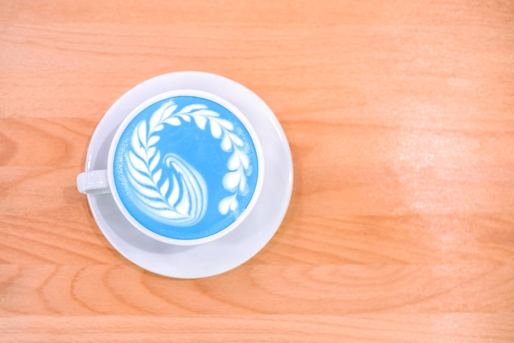 Coffee Latte with Blue Art Work.