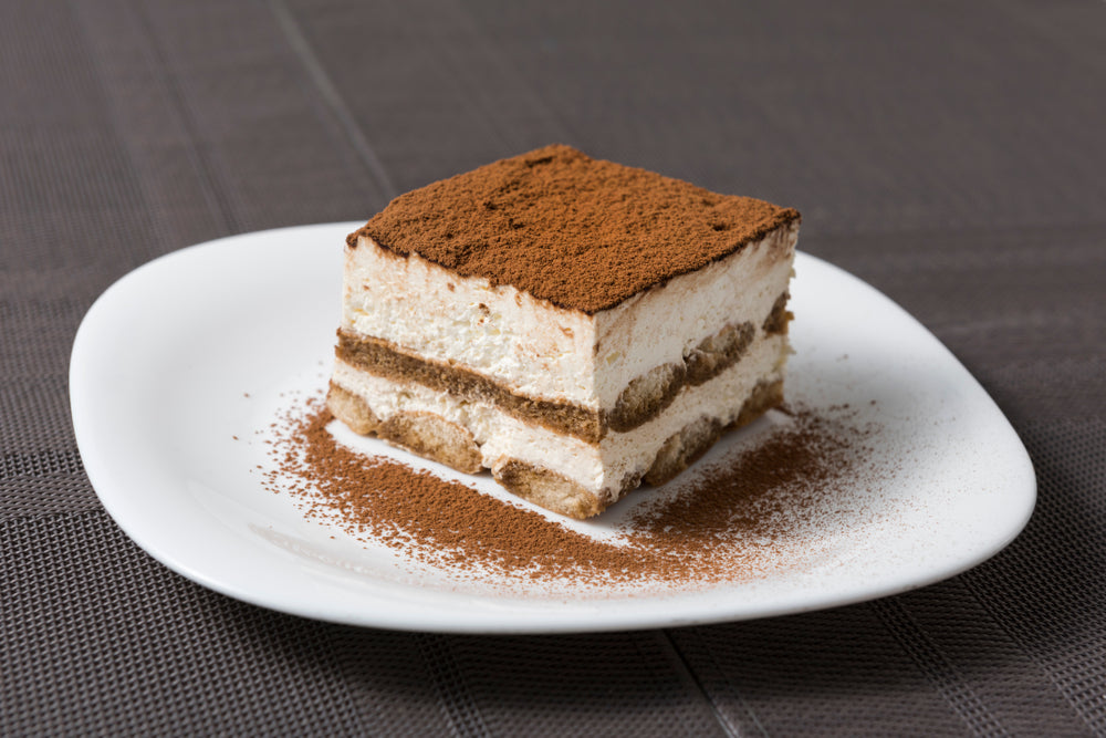 Tiramisu on white plate.