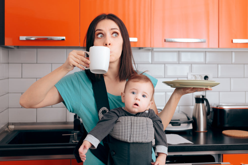 Busy Multitasking Mom with Baby, Coffee Mug and Dishes.