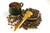 Coffee beans of two kind in a little brown cup and saucer with gold ritual knife from Peru.