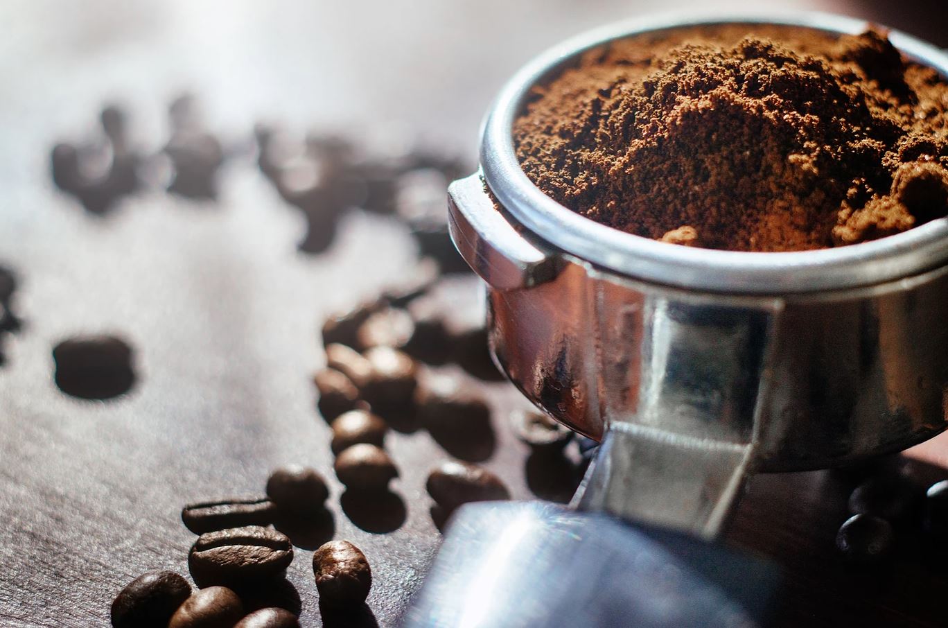 Ground espresso coffee in an espresso machines portafilter.