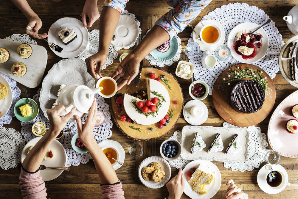 Friends Gathering Together on Tea Party Eating Cakes.